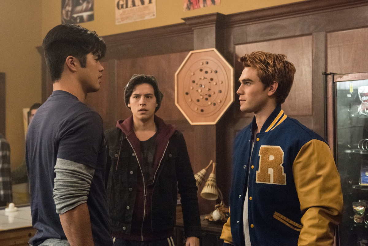 Riverdale -- "Chapter Two: A Touch of Evil" -- Image Number: RVD102d_0448.jpg -- Pictured: Ross Butler as Reggie Mantle, Cole Sprouse as Jughead Jones and KJ Apa as Archie Andrews -- Photo: Dean Buscher/The CW -- ÃÂ© 2016 The CW Network. All Rights Reserved