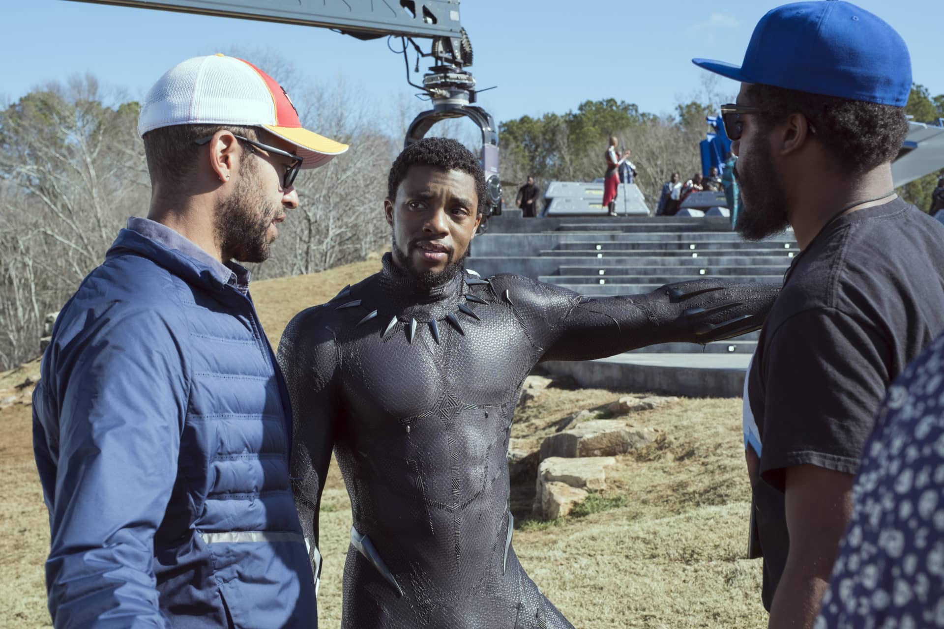 Marvel Studios' BLACK PANTHER..L to R: Executive Producer Nate Moore, Chadwick Boseman (T'Challa/Black Panther) on set with Director Ryan Coogler..Ph: Matt Kennedy..©Marvel Studios 2018