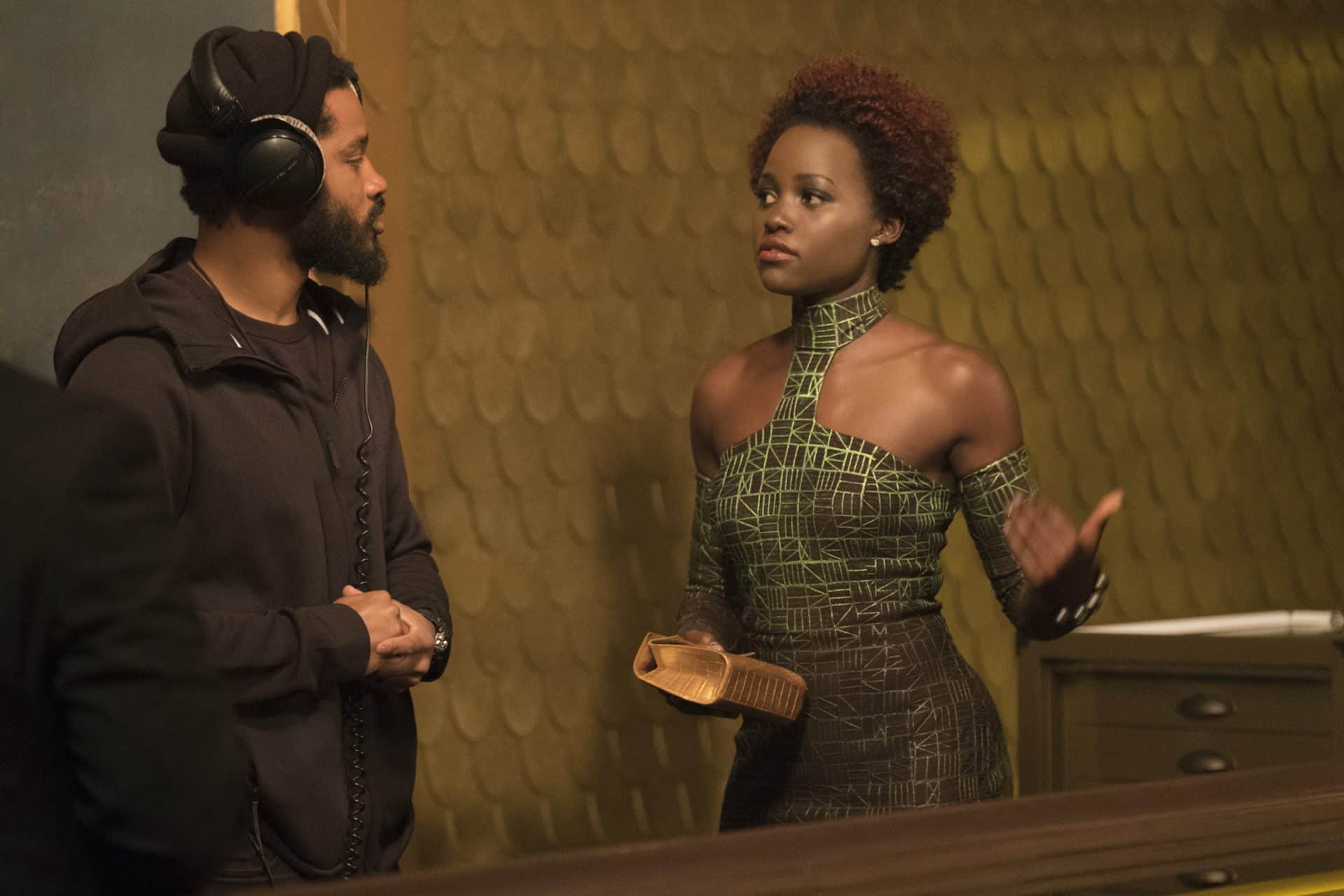 Marvel Studios' BLACK PANTHER..L to R: Director Ryan Coogler on set with Lupita Nyong'o (Nakia)..Ph: Matt Kennedy..©Marvel Studios 2018
