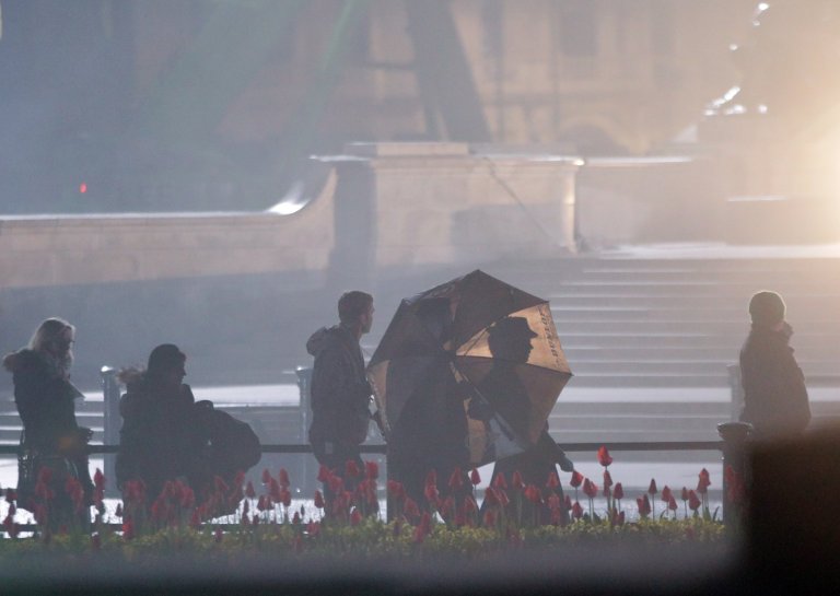 Emily Blunt (visible behind umbrella) prepares to film a scene from the movie sequel Mary Poppins Returns in front of Buckingham Palace, central London. PRESS ASSOCIATION Photo. Picture date: Saturday April 1, 2017. See PA story SHOWBIZ MaryPoppins. Photo credit should read: Yui Mok/PA Wire