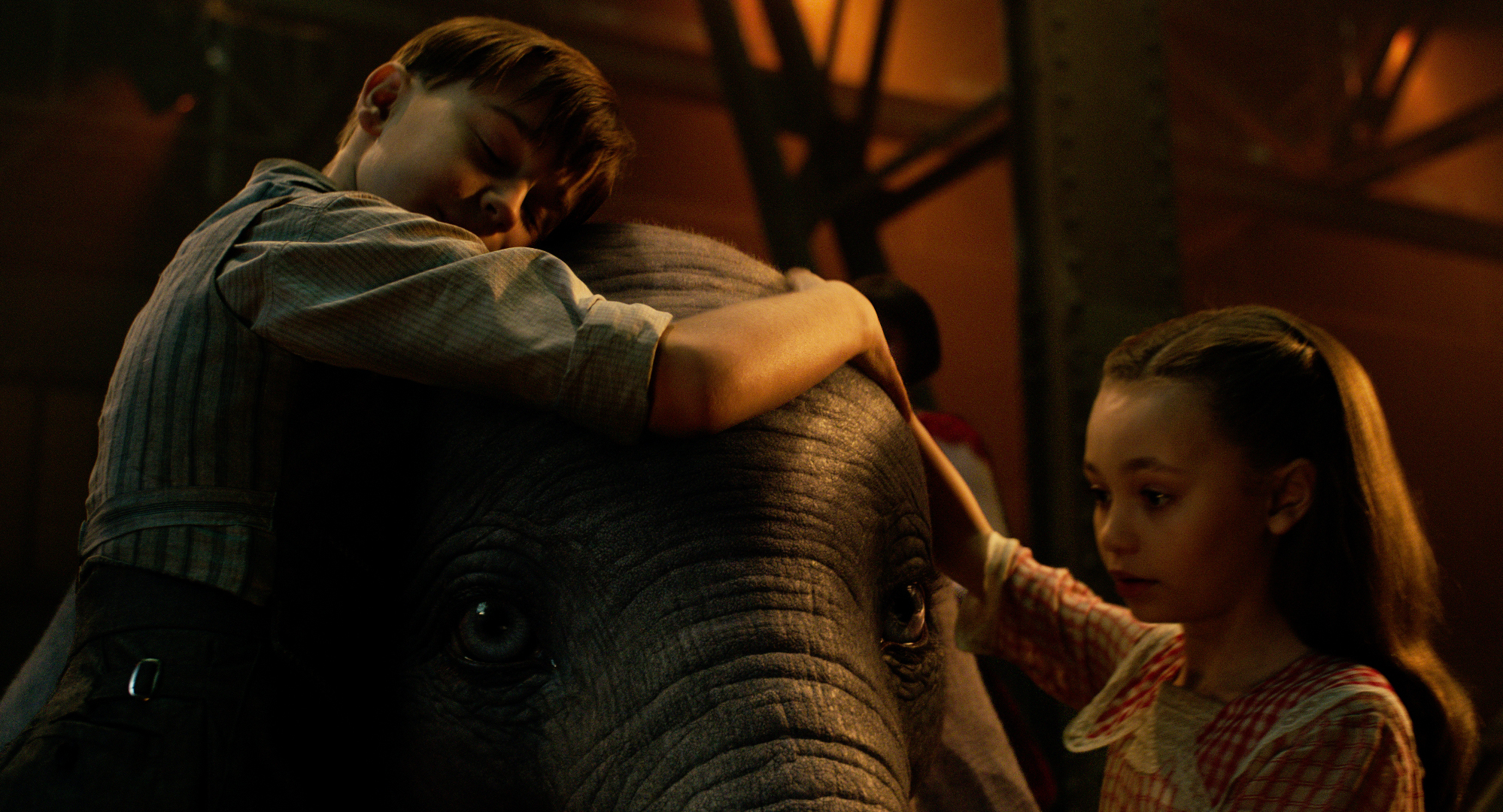TRUE LOVE -- When former circus star Holt Farrier (Colin Farrell) is charged with taking care of a newborn elephant whose oversized ears make him a laughingstock in an already struggling circus, he’s surprised by just how quickly his children (Finley Hobbins and Nico Parker) fall for the peculiar pachyderm. Directed by Tim Burton and produced by Katterli Frauenfelder, Derek Frey, Ehren Kruger and Justin Springer, Disney’s all-new, live-action reimagining of “Dumbo” flies into theaters on March 29, 2019. © 2018 Disney Enterprises, Inc. All Rights Reserved.