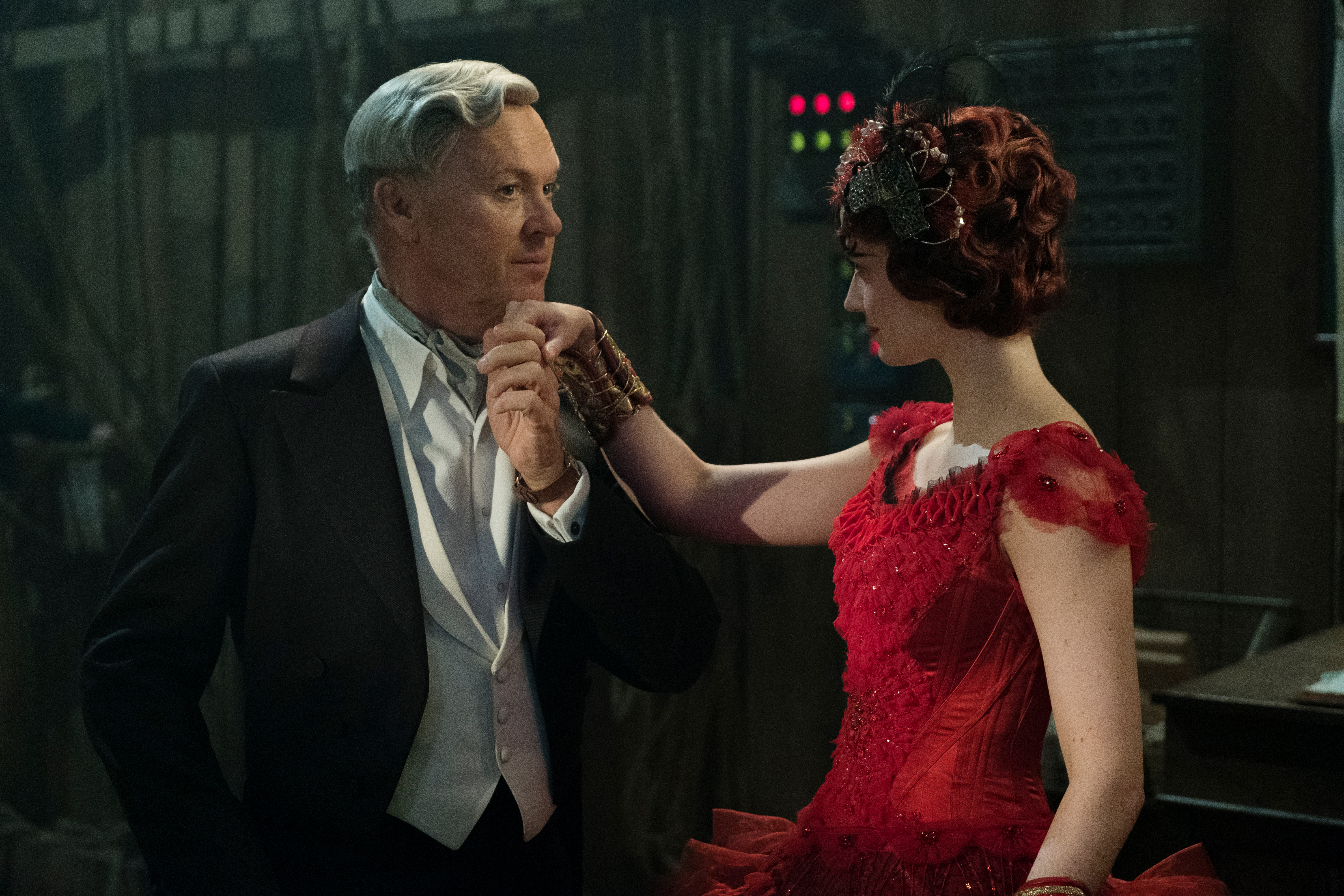 BUILDING DREAMS -- In Tim Burton’s all-new, live-action reimagining of “Dumbo,” persuasive entrepreneur V.A. Vandevere (Michael Keaton) decides that a young elephant from a struggling circus belongs in his newest, larger-than-life entertainment venture, Dreamland, alongside charming and spectacular aerial artist Colette Marchant (Eva Green). Directed by Burton and produced by Katterli Frauenfelder, Derek Frey, Ehren Kruger and Justin Springer, “Dumbo” flies into theaters on March 29, 2019.  Photo by Jay Maidment. © 2018 Disney Enterprises, Inc. All Rights Reserved.