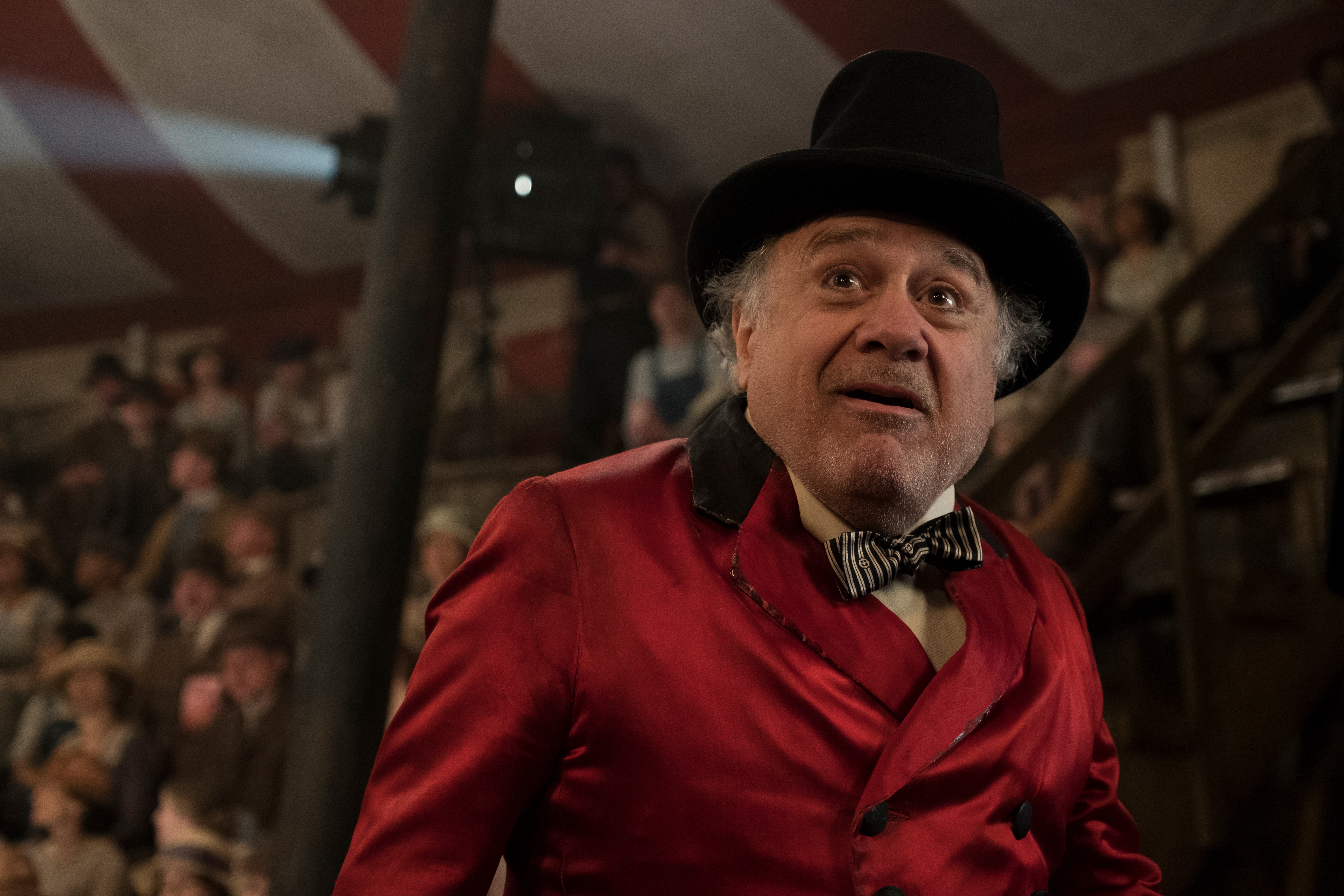 MEET MEDICI -- In Tim Burton’s all-new, live-action reimagining of “Dumbo,” struggling circus owner Max Medici (Danny DeVito) is disappointed to learn that a newborn elephant has enormous ears. But when Medici realizes that the elephant can fly, the circus’ return to prosperity suddenly becomes a real possibility. Directed by Burton and produced by Katterli Frauenfelder, Derek Frey, Ehren Kruger and Justin Springer, Disney’s all-new, live-action reimagining of “Dumbo” flies into theaters on March 29, 2019. Photo by Jay Maidment  © 2018 Disney Enterprises, Inc. All Rights Reserved.