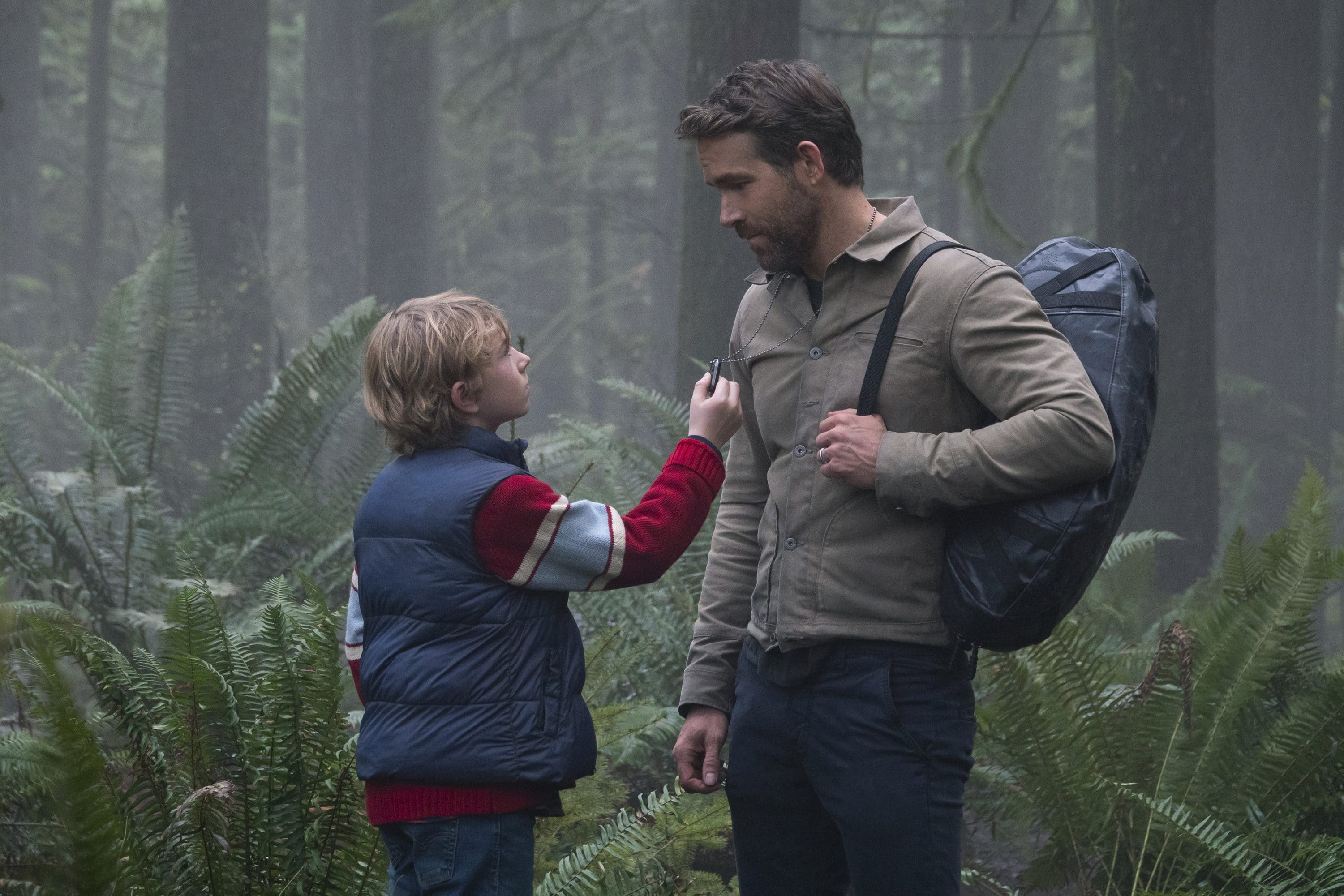 The Adam Project (L to R) Walker Scobell as Young Adam and Ryan Reynolds as Big Adam. Cr. Doane Gregory/Netflix © 2022