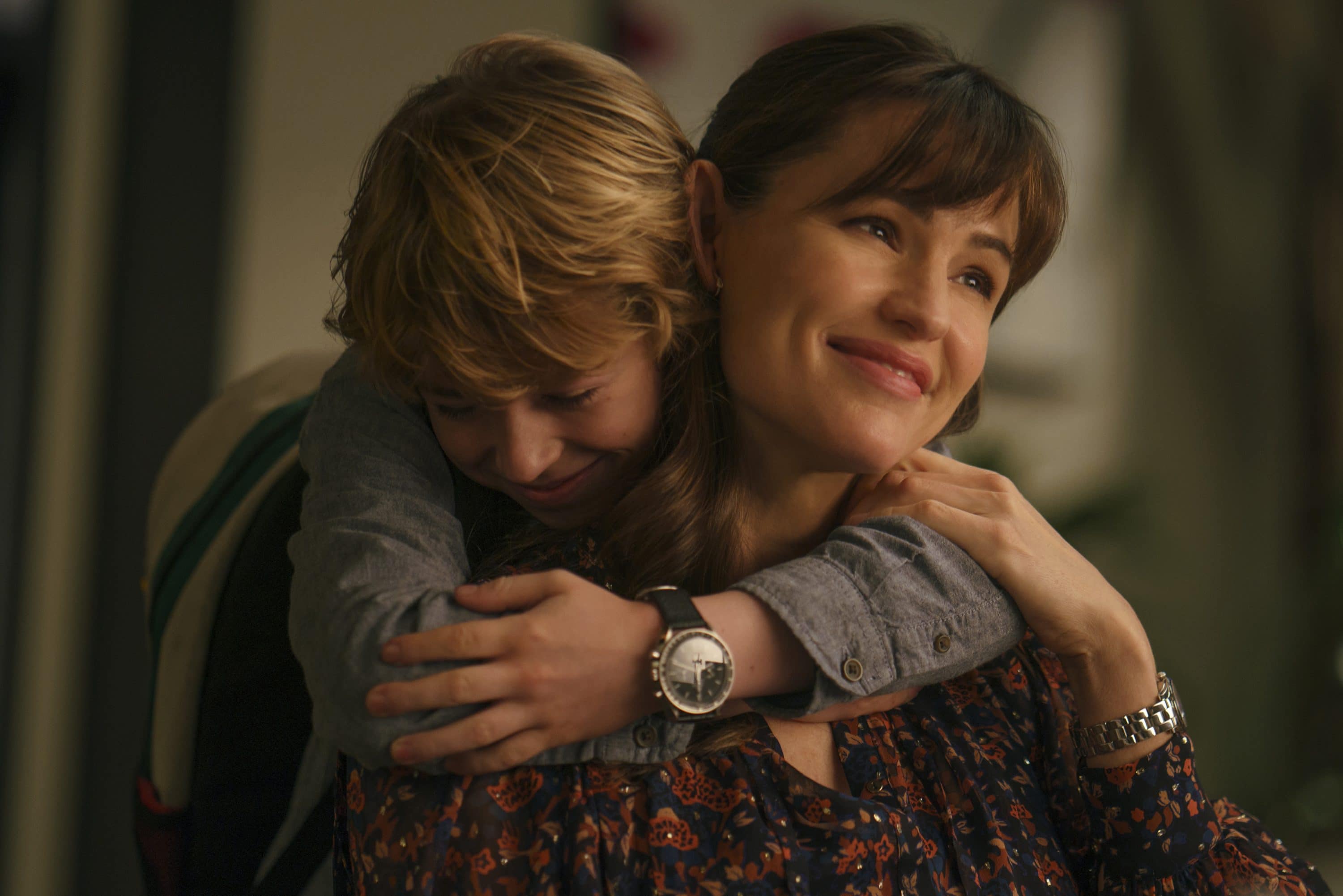 The Adam Project (L to R) Walker Scobell as Young Adam and Jennifer Garner as Ellie. Cr. Doane Gregory/Netflix © 2022