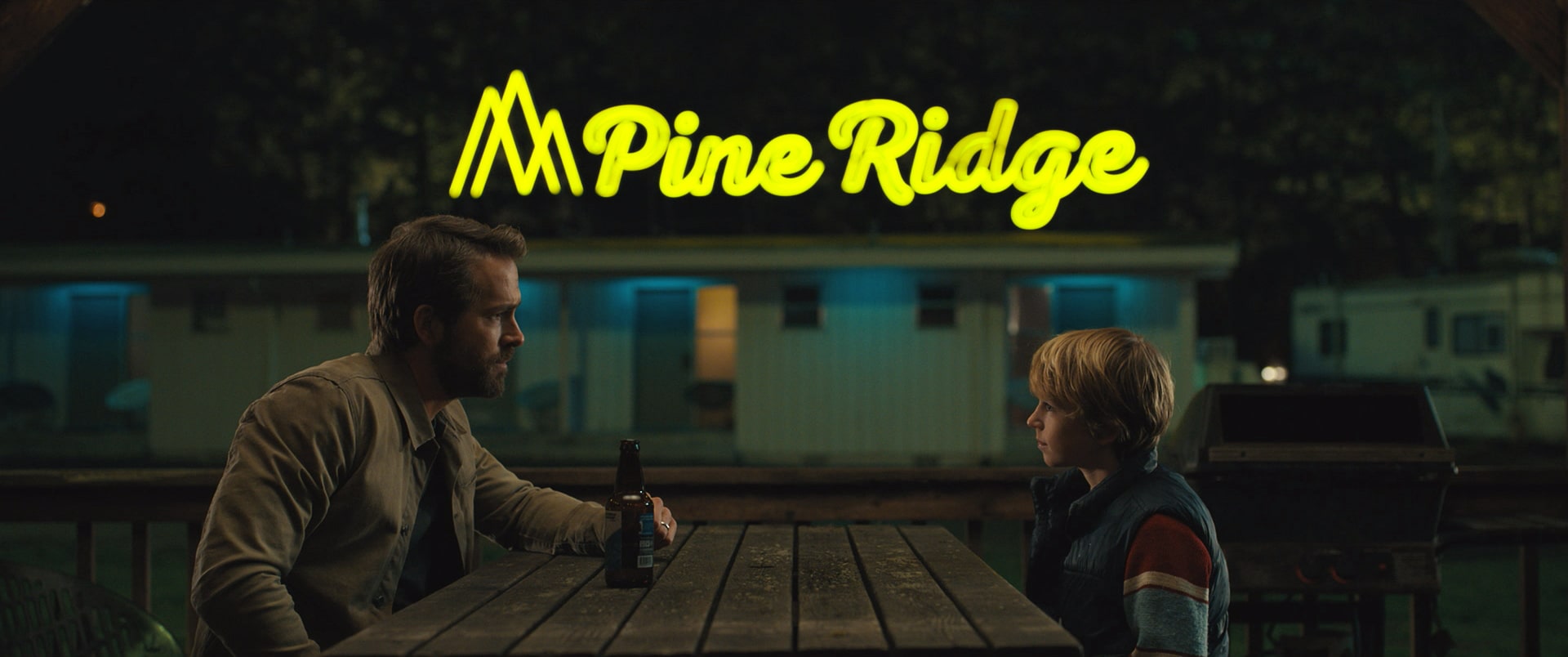 The Adam Project - (L to R) Ryan Reynolds as Big Adam and Walker Scobell as Young Adam. Cr. Netflix © 2022