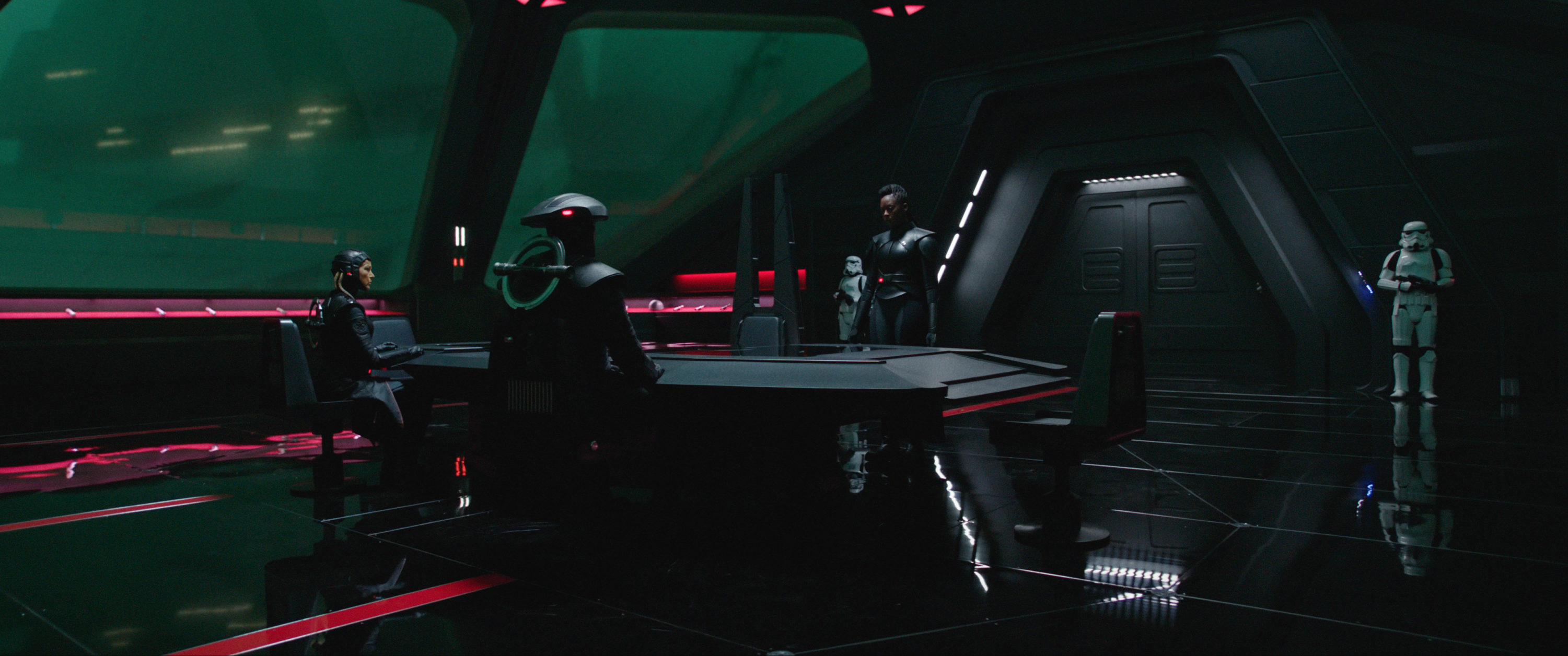 Fifth Brother (Sung Kang, seated on right) and Reva (Moses Ingram, standing) in Lucasfilm's OBI-WAN KENOBI, exclusively on Disney+. © 2022 Lucasfilm Ltd. &amp; ™. All Rights Reserved.