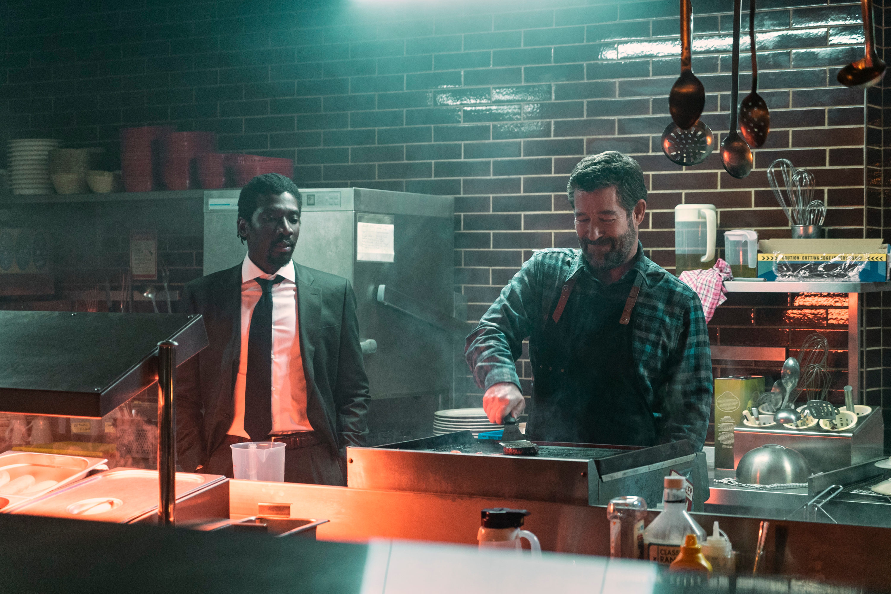 The Sandman. (L to R) James Udom as Garry Fletcher, Steven Brand as Marsh Janowski in episode 105 of The Sandman. Cr. Liam Daniel/Netflix © 2022