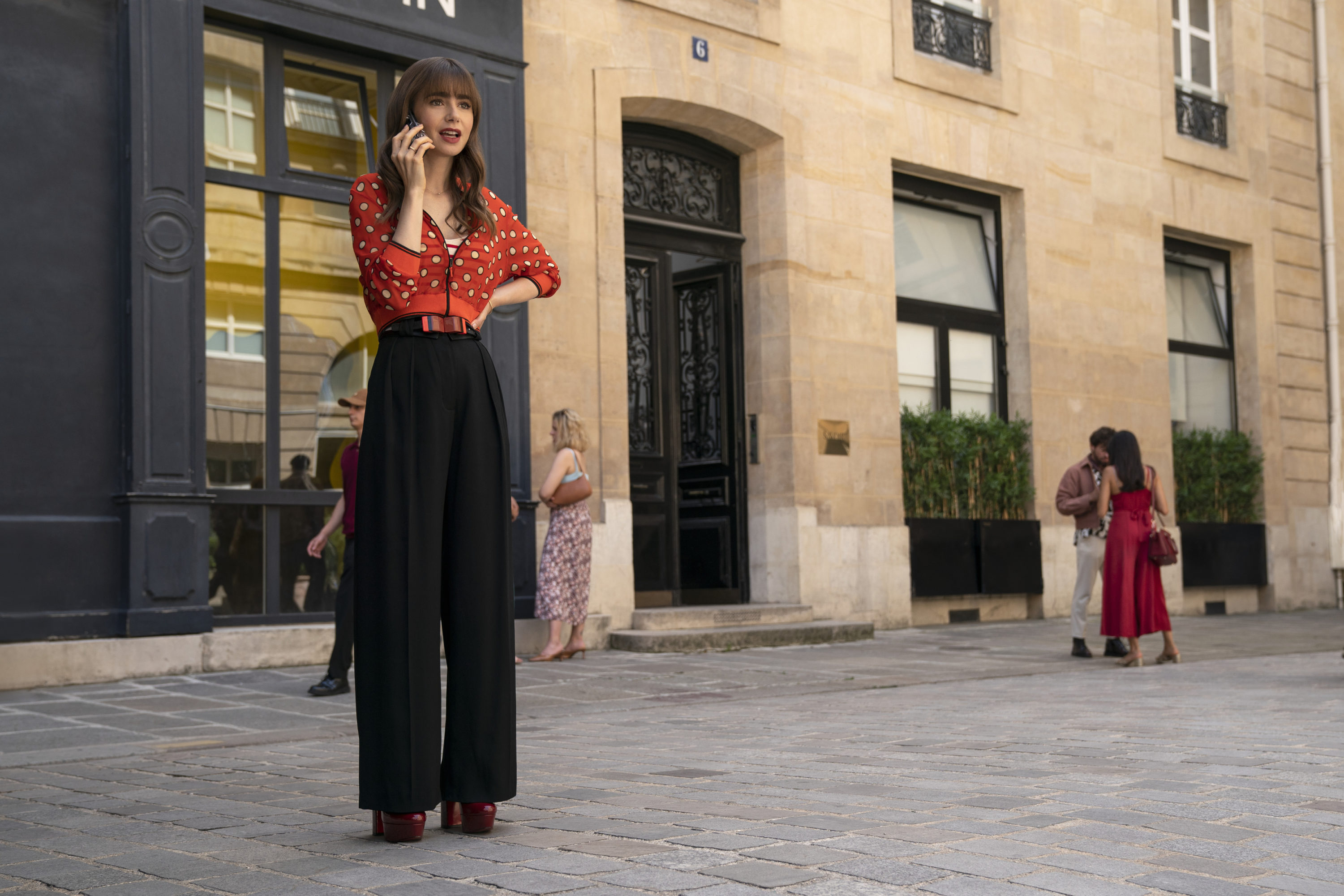 Emily in Paris. Lily Collins as Emily in episode 303 of Emily in Paris. Cr. Stéphanie Branchu/Netflix © 2022