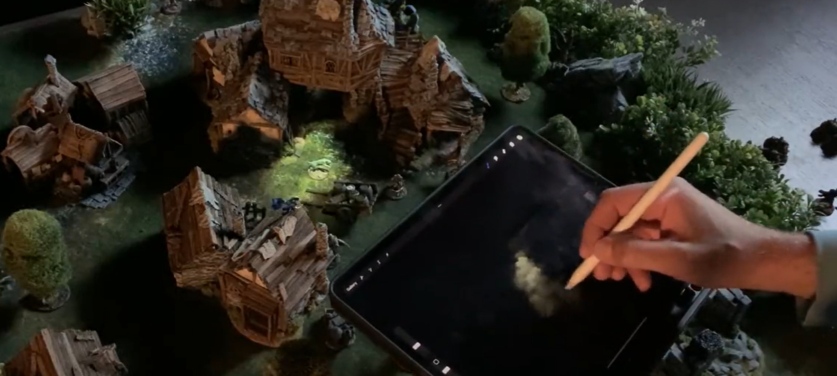 Artista usa projetor para criar iluminação dinâmica em cenário de boardgame