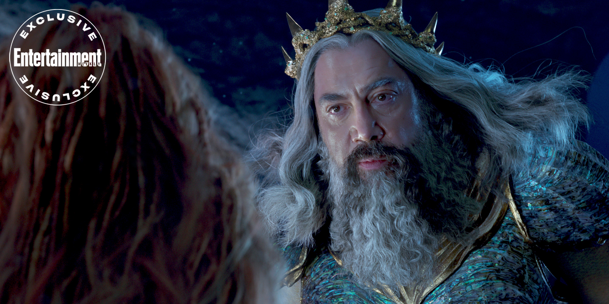 (L-R): Halle Bailey as Ariel and Javier Bardem as King Triton in Disney's live-action THE LITTLE MERMAID. Photo courtesy of Disney. © 2023 Disney Enterprises, Inc. All Rights Reserved.