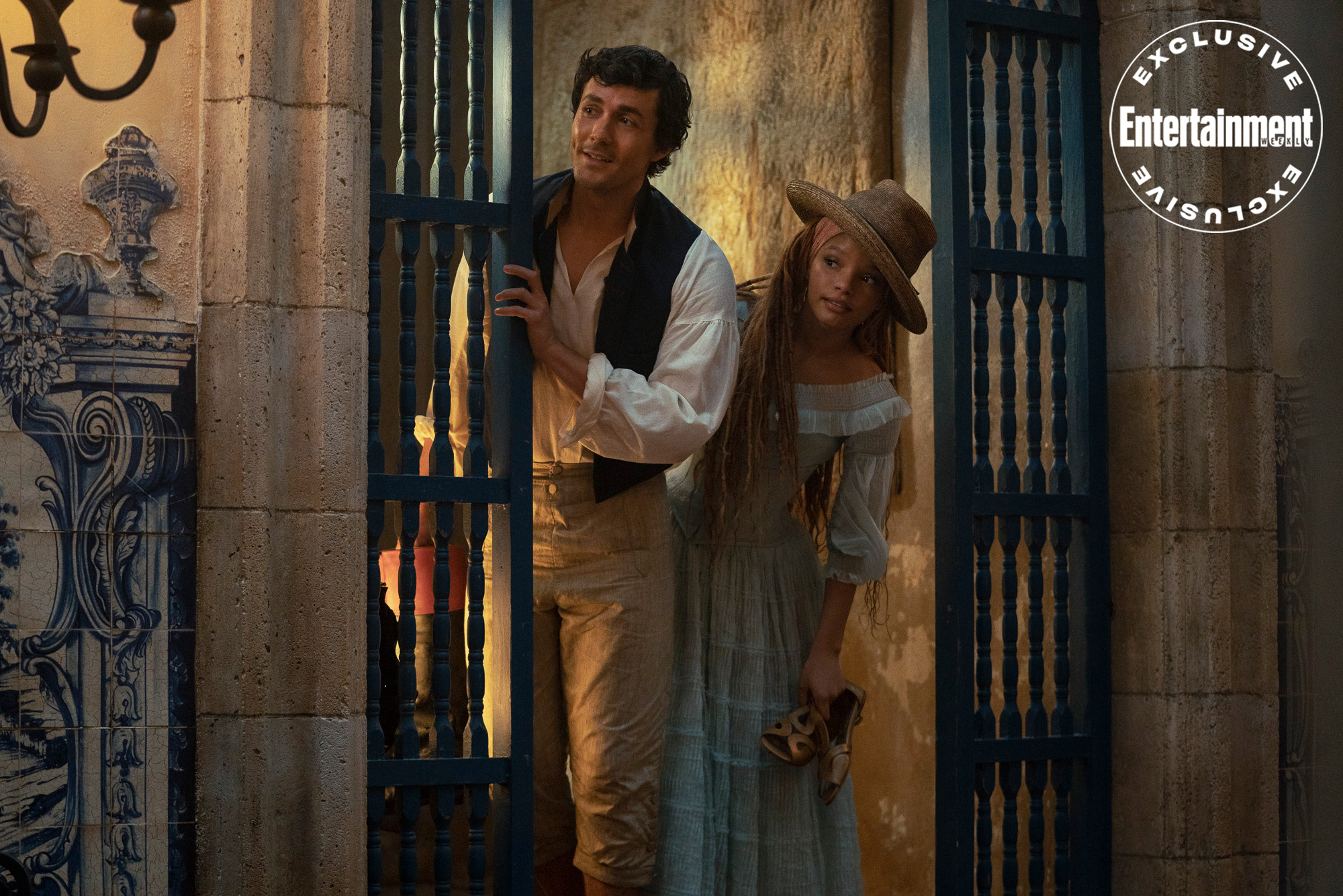 (L-R): Jonah Hauer-King as Prince Eric and Halle Bailey as Ariel in Disney's live-action THE LITTLE MERMAID. Photo by Giles Keyte. © 2023 Disney Enterprises, Inc. All Rights Reserved.