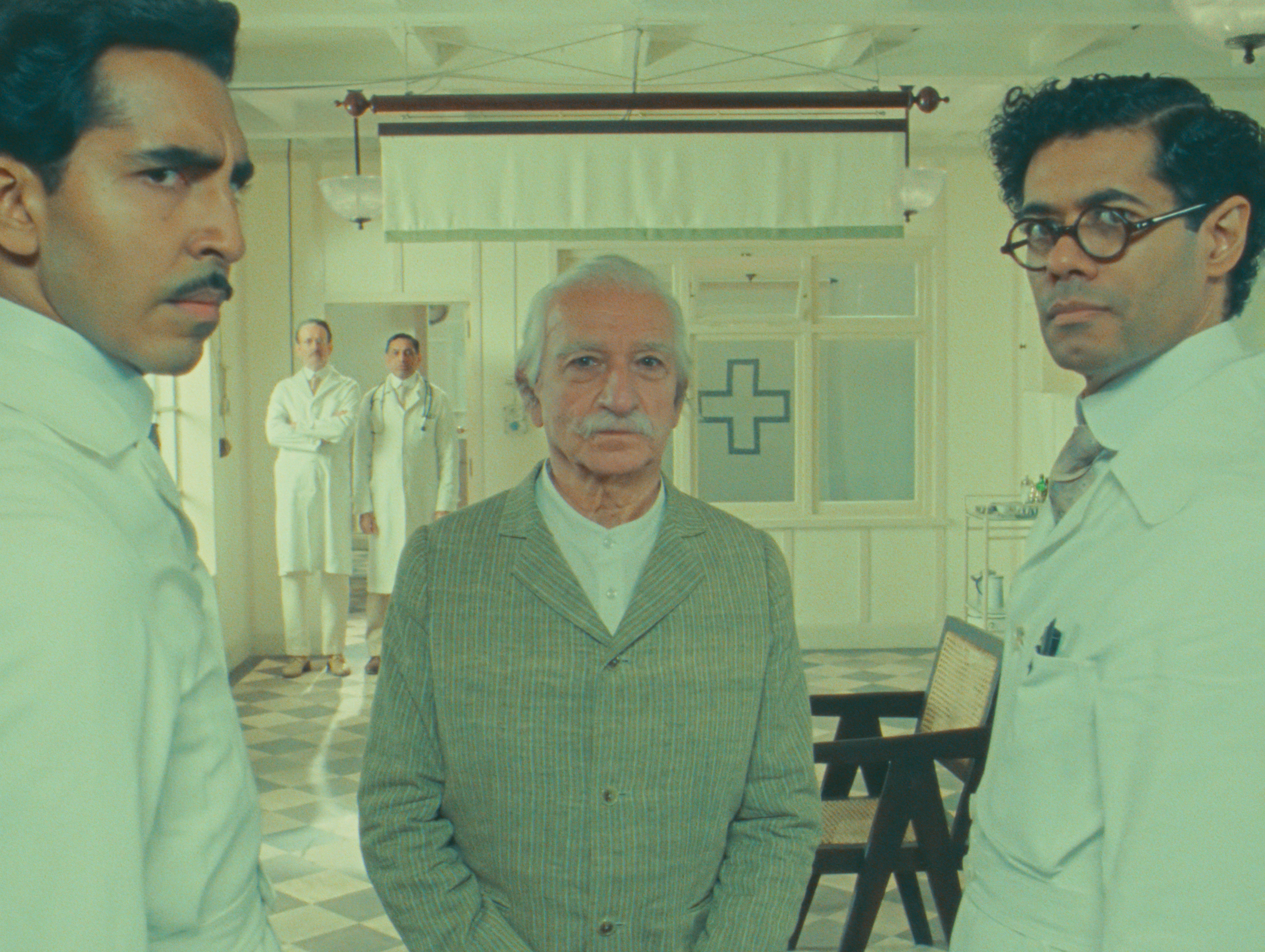 Roald Dahl's The Wonderful Story of Henry Sugar (L-R) Dev Patel as Dr. Chatterjee, Sir Ben Kingsley as Imdad Khan and Richard Ayoade as Dr. Marshall in Roald Dahl's The Wonderful Story of Henry Sugar. Cr. Netflix ©2023