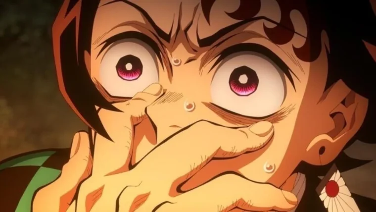 Imagem de Kamado Tanjiro, de Demon Slayer, cobrindo a boca com uma expressão horrorizada.